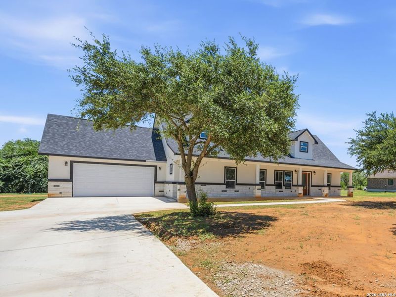 Front exterior of a new home in , Lytle, TX, highlighting curb appeal (Image 23).