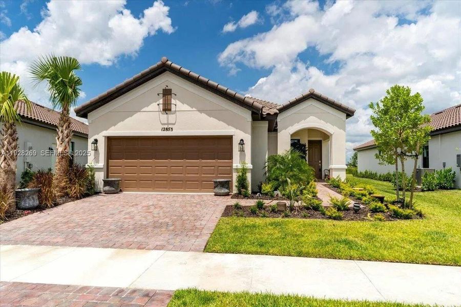 Front exterior of a new home in , Port St. Lucie, FL, highlighting curb appeal (Image 1). Front exterior of a new home in , Port St. Lucie, FL, highlighting curb appeal (Image 1).