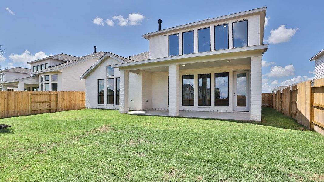 Exterior details and patio area of a home in Lakes of Cane Island, Katy (Image 3).