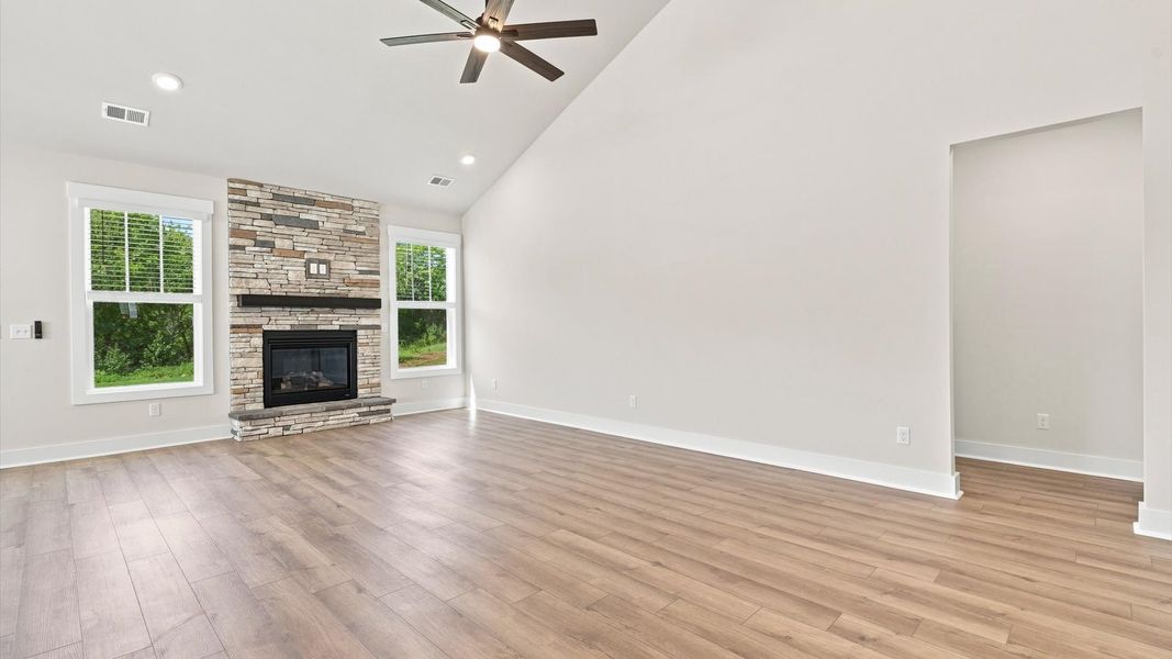 First-rate family room with eye-catching two-story ceilings and superior architectural detail at the Fox Hollow community