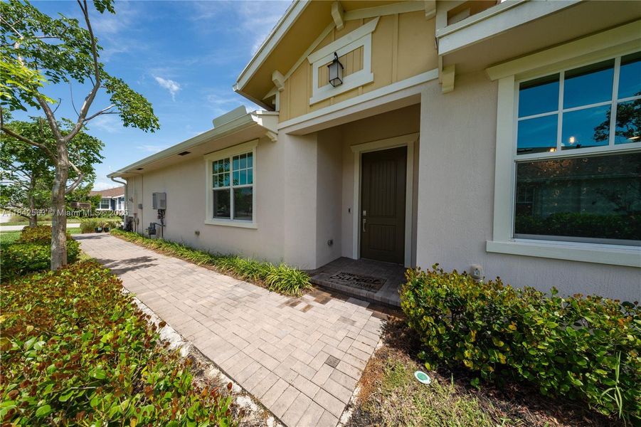 Front exterior of a new home in , Loxahatchee, FL, highlighting curb appeal (Image 27).