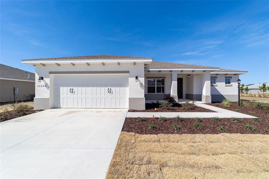 Front exterior of a new home in On Top of the World Communities, Ocala, FL, highlighting curb appeal (Image 20).