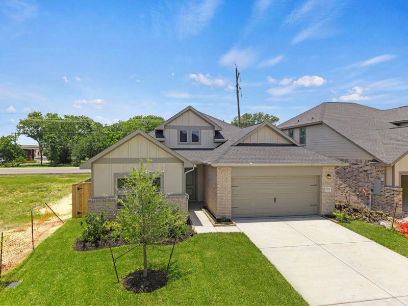 Front exterior of a new home in Laurel Landing, Alvin, TX, highlighting curb appeal (Image 17). Front exterior of a new home in Laurel Landing, Alvin, TX, highlighting curb appeal (Image 17).