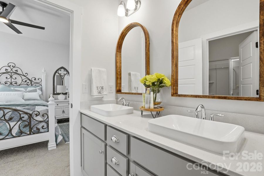 Jack and Jill bathroom connects the 2 secondary bedrooms