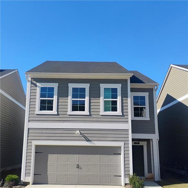 Front exterior of a new home in , Calhoun, GA, highlighting curb appeal (Image 2). Front exterior of a new home in , Calhoun, GA, highlighting curb appeal (Image 2).