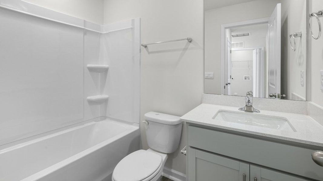 Furnished interior view inside a new home in The Townes at Ridgewood Farms, Winterville (Image 7).