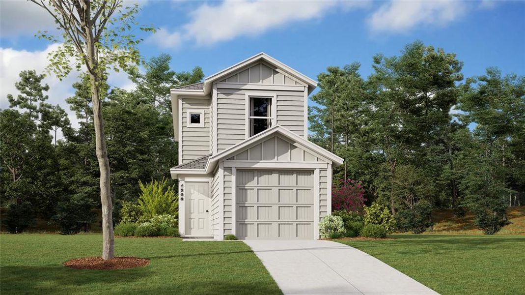 View of front of property featuring a front lawn and a garage