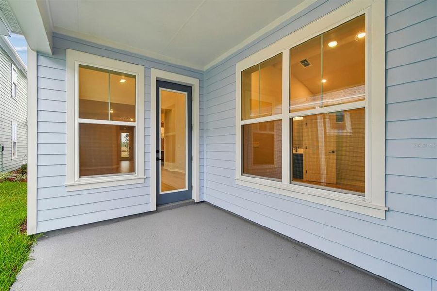 Exterior details and patio area of a home in Laureate Park at Lake Nona - Garden Series, Orlando (Image 3).