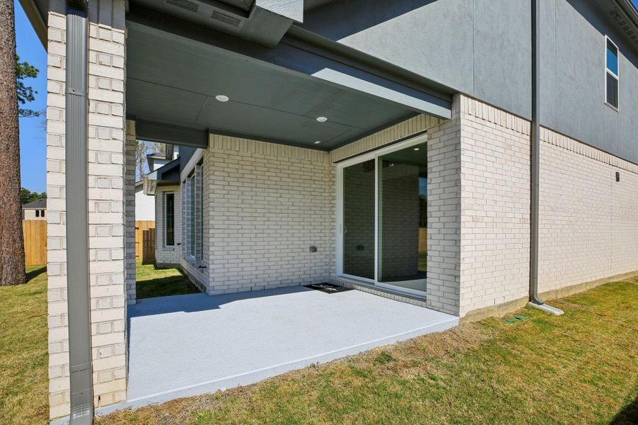 Exterior details and patio area of a home in , Magnolia (Image 3).