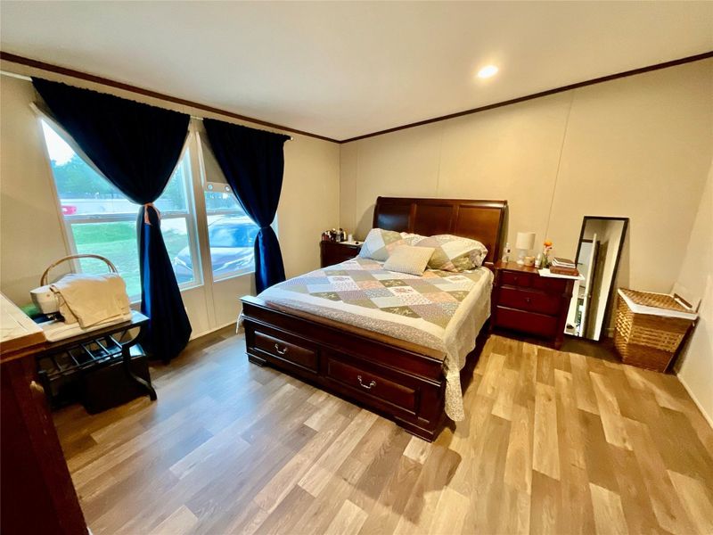Light wood-finish flooring throughout, complemented by a light wall color