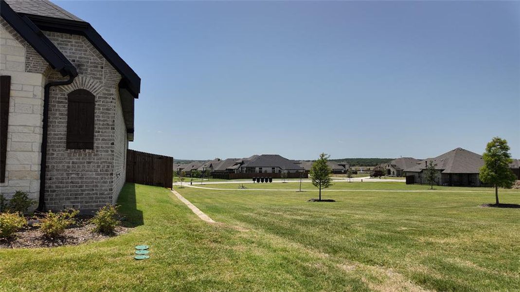 Exterior details and patio area of a home in Panchasarp Farms, Burleson (Image 24). Exterior details and patio area of a home in Panchasarp Farms, Burleson (Image 24).