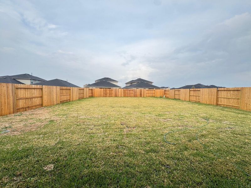 Exterior details and patio area of a home in Sunterra, Katy (Image 3).