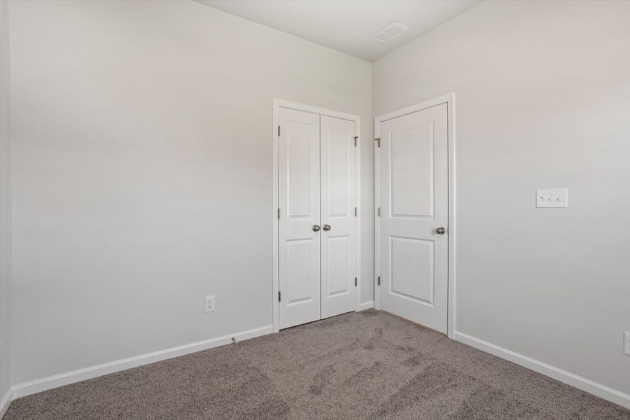 Spacious, unfurnished interior of a new home in Cambridge Reserve, Angier (Image 25).