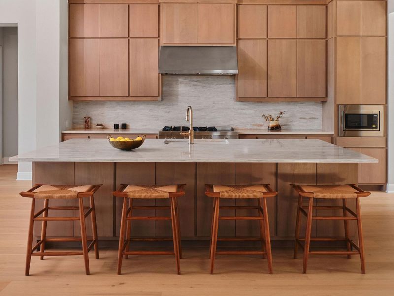 A spacious center island with seating sets the stage for entertaining.