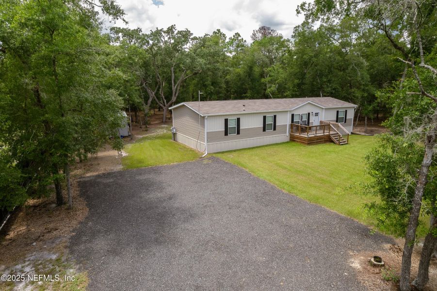 Front exterior of a new home in , Pomona Park, FL, highlighting curb appeal (Image 20).