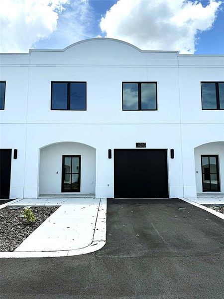 Front exterior of a new home in , Tampa, FL, highlighting curb appeal (Image 1). Front exterior of a new home in , Tampa, FL, highlighting curb appeal (Image 1).