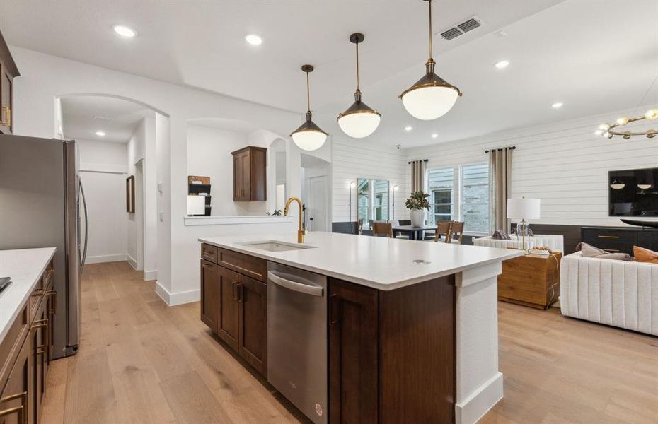 *Model Representation - Large island overlooking gathering room and dining areas