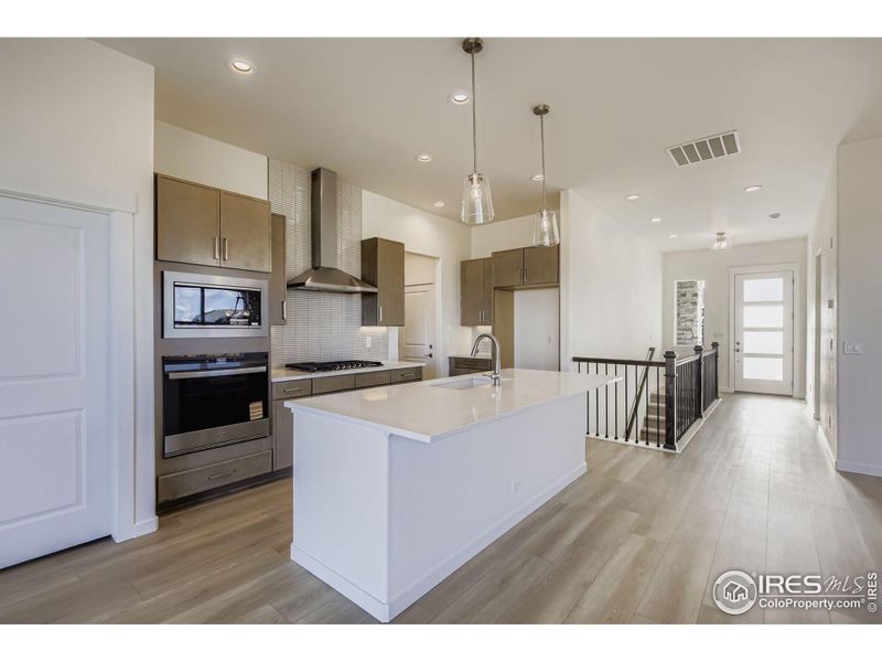 Furnished interior view inside a new home in RainDance - 60s, Windsor (Image 8).