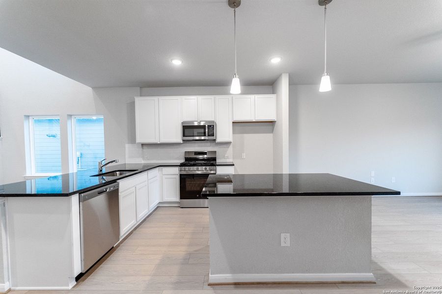 Furnished interior view inside a new home in Hennersby Hollow, San Antonio (Image 3).