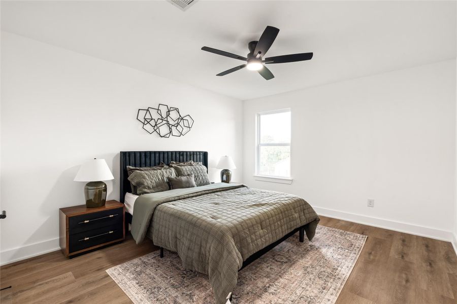 The oversized secondary bedrooms continue the home's commitment to durable LVP flooring, with zero carpet anywhere in the home. The oversized secondary bedrooms continue the home's commitment to durable LVP flooring, with zero carpet anywhere in the home.