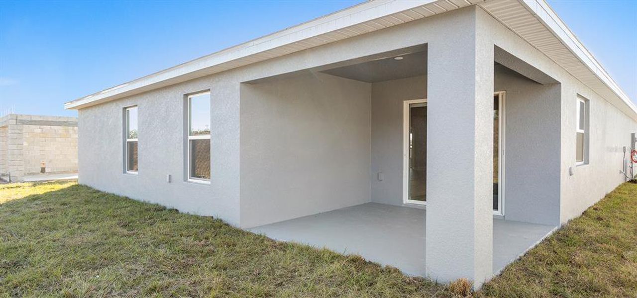 Exterior details and patio area of a home in Bennah Oaks, Belleview (Image 2).