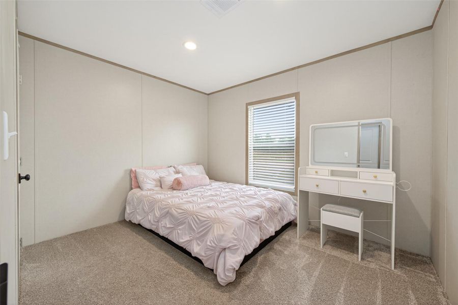 Secondary bedroom showcasing flexibility and usability with a clean and practical design Secondary bedroom showcasing flexibility and usability with a clean and practical design