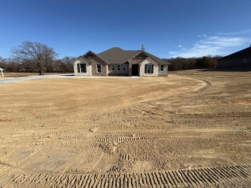 View of front of property with stone siding