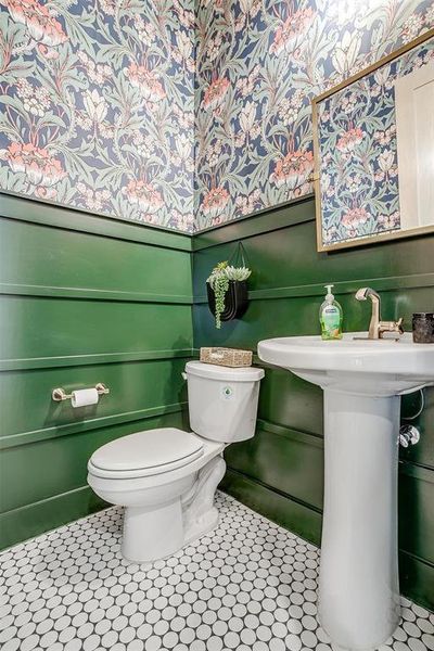 Bathroom featuring toilet and tile patterned flooring
