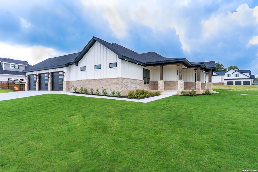 Front exterior of a new home in , La Vernia, TX, highlighting curb appeal (Image 20). Front exterior of a new home in , La Vernia, TX, highlighting curb appeal (Image 20).