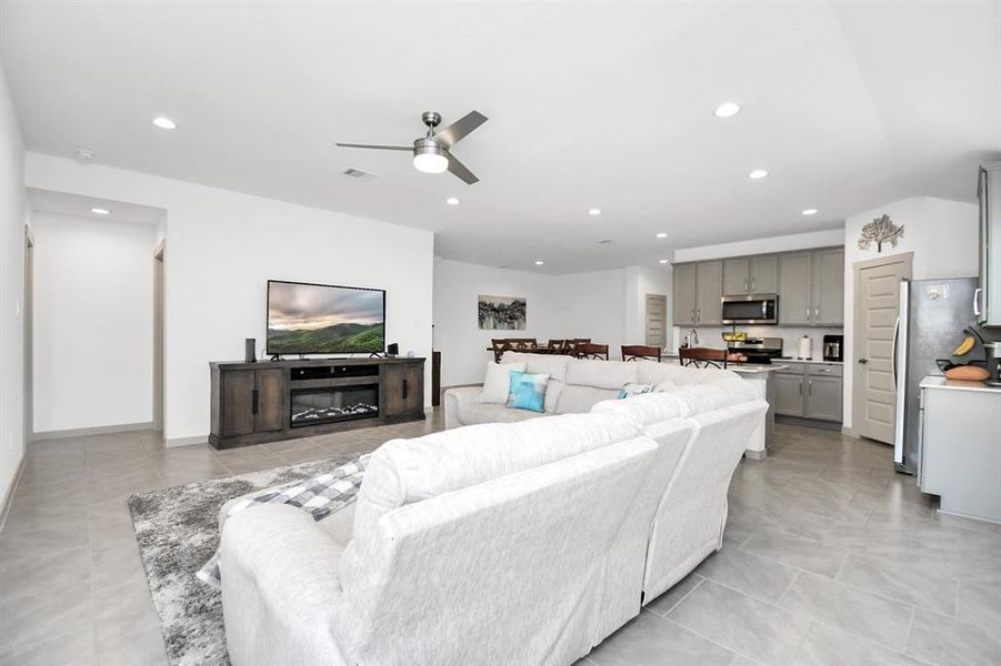 Living room open to kitchen and dining area