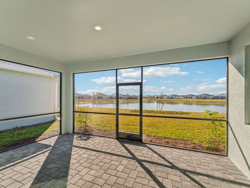 Exterior details and patio area of a home in Crescent Lakes - Signature Series, Punta Gorda (Image 3).