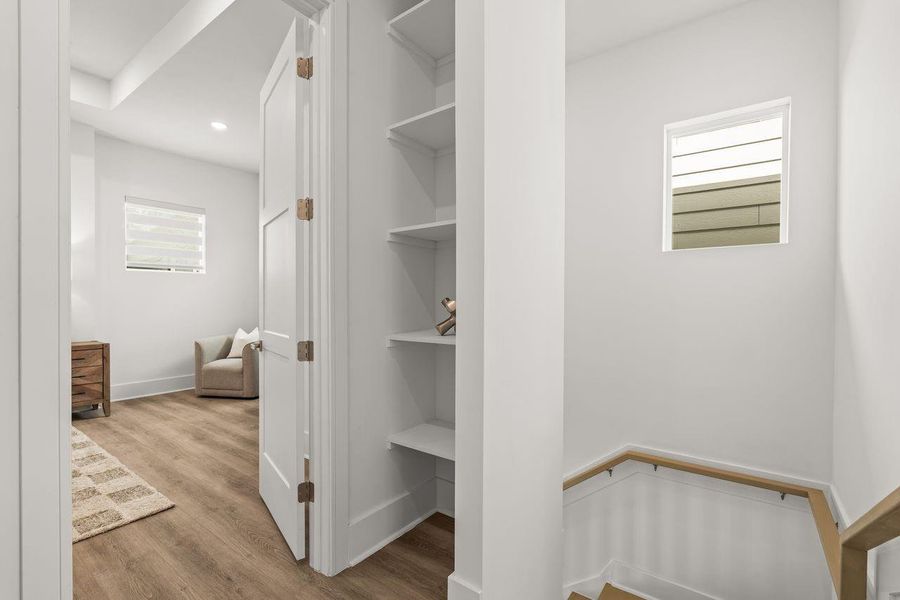 Defined by thoughtful transitions, the upper-level hallway creates a seamless connection between private living spaces. The result is a home that feels organized, intuitive, and effortlessly connected from one room to the next.