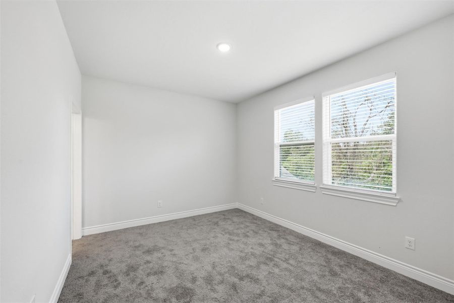 Upstairs 3rd bedroom with its personal bathroom on the left