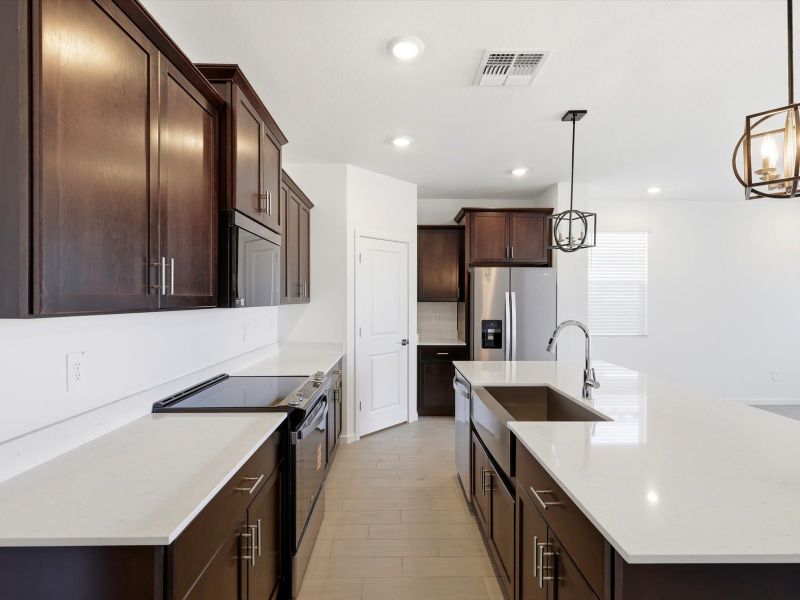 Furnished interior view inside a new home in Meritage Homes by Teravalis - Estate Series, Buckeye (Image 3).