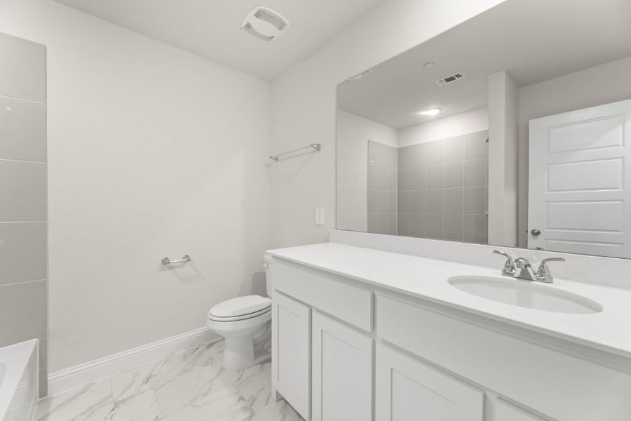 Front exterior of a new home in Main Street Village, Mansfield, TX, highlighting curb appeal (Image 18). Front exterior of a new home in Main Street Village, Mansfield, TX, highlighting curb appeal (Image 18).