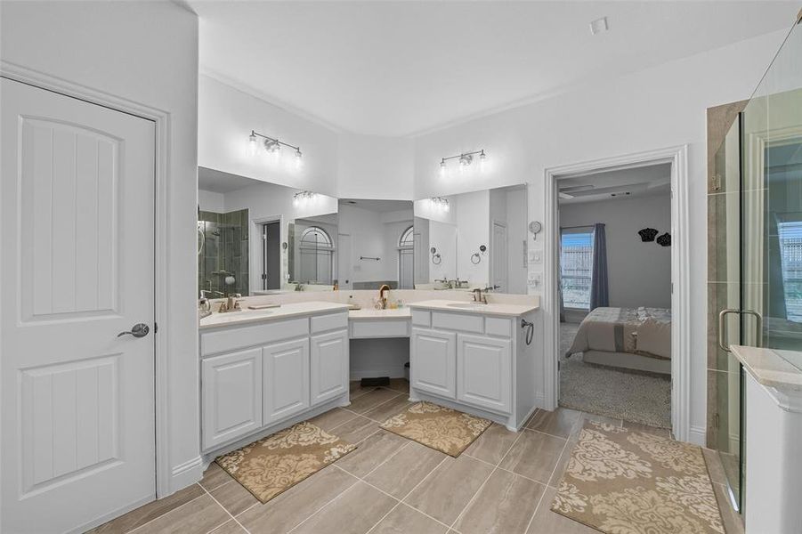 Ensuite bathroom with a shower stall and two vanities Ensuite bathroom with a shower stall and two vanities