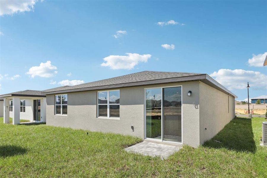 Exterior details and patio area of a home in Crosswinds - Signature Series, Haines City (Image 26).