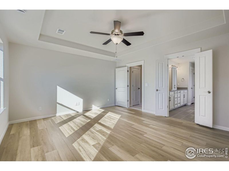 Spacious, unfurnished interior of a new home in RainDance National 60/70, Windsor (Image 20).