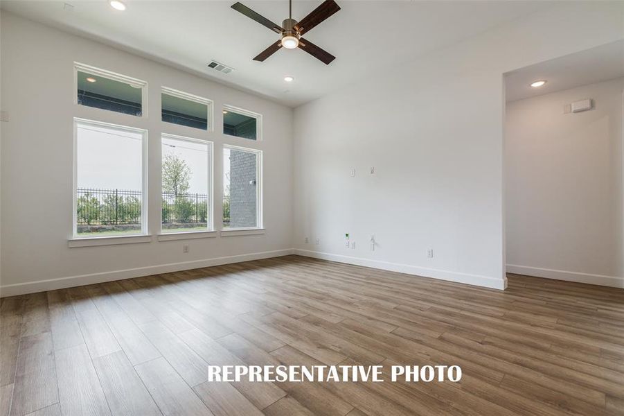 Spacious and light filled, this family room is large enough for the entire family!  REPRESENTATIVE PHOTO