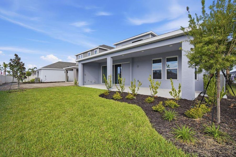 Exterior details and patio area of a home in Indigo Creek, Apollo Beach (Image 13).