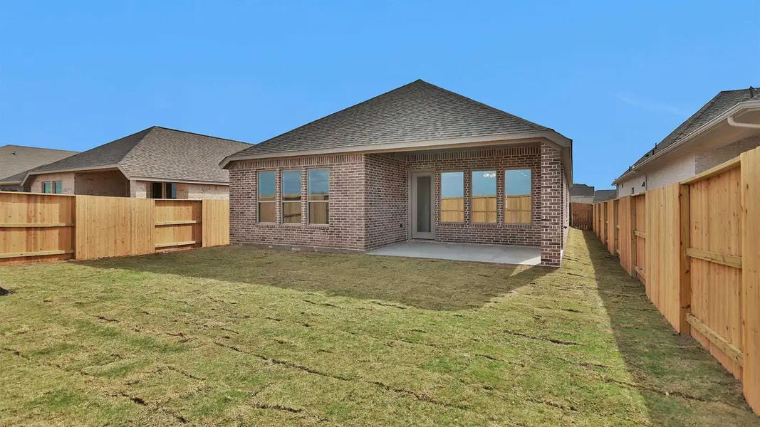 Exterior details and patio area of a home in Meridiana, Manvel (Image 4).