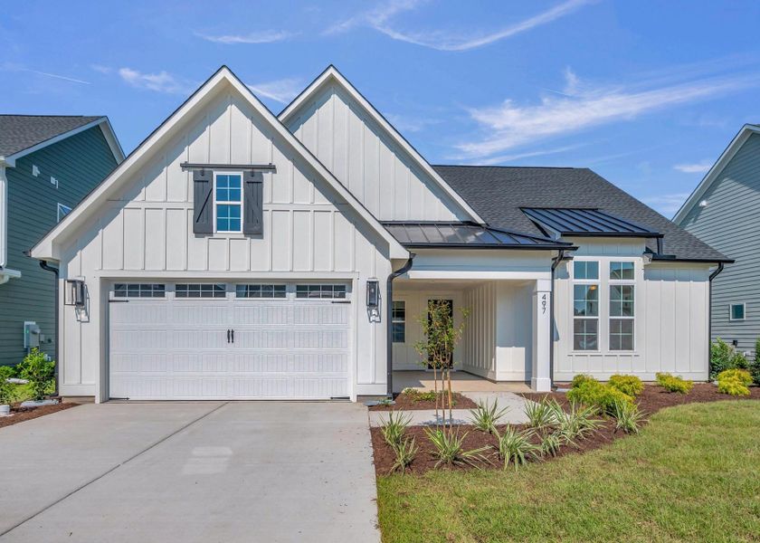 Representative exterior photo of a completed home built from the The Bradley by RobuckHomes in Windwater, Hampstead, NC (Image 28).