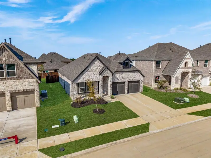 Front exterior of a new home in Edgewood Creek, Celina, TX, highlighting curb appeal (Image 1).