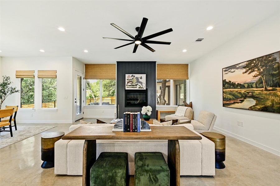 Living room with gas fireplace and direct views to covered patio and backyard oaks. Living room with gas fireplace and direct views to covered patio and backyard oaks.