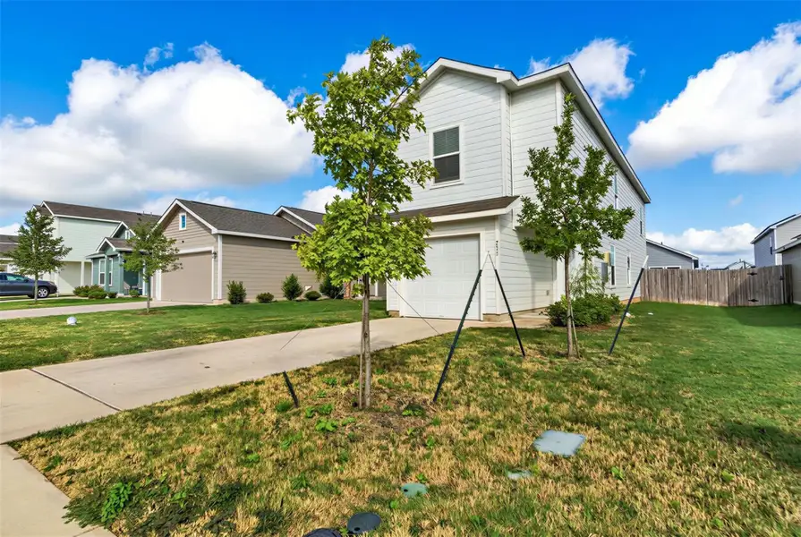 Crisp vertical siding and a neat concrete driveway define this modern exterior. Crisp vertical siding and a neat concrete driveway define this modern exterior.