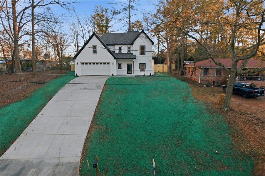 Front exterior of a new home in , Conyers, GA, highlighting curb appeal (Image 26). Front exterior of a new home in , Conyers, GA, highlighting curb appeal (Image 26).