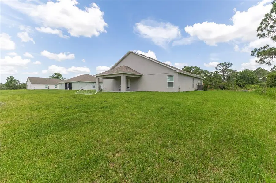 Exterior details and patio area of a home in , Sebring (Image 3).