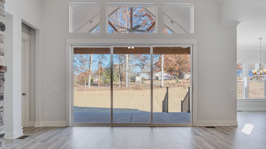 Large sliding glass door separating indoor and outdoor living areas