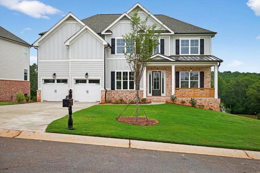 Front exterior of a new home in Traditions Of Braselton, Jefferson, GA, highlighting curb appeal (Image 1). Front exterior of a new home in Traditions Of Braselton, Jefferson, GA, highlighting curb appeal (Image 1).