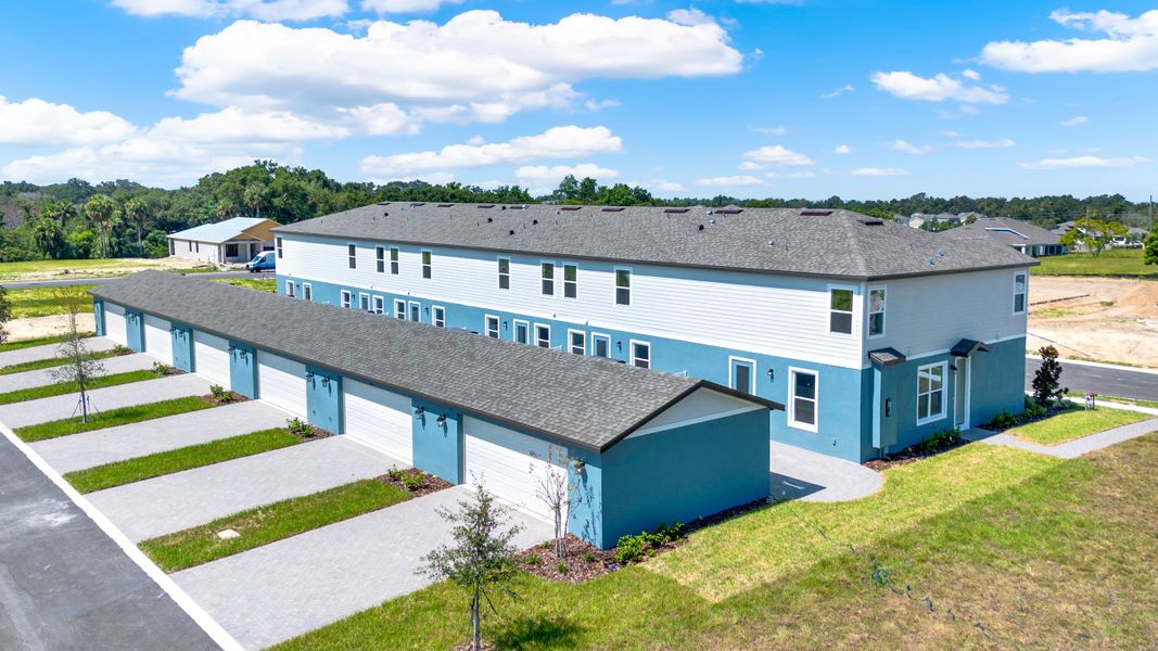 Front exterior of a new home in Eden Crest, Apopka, FL, highlighting curb appeal (Image 16).